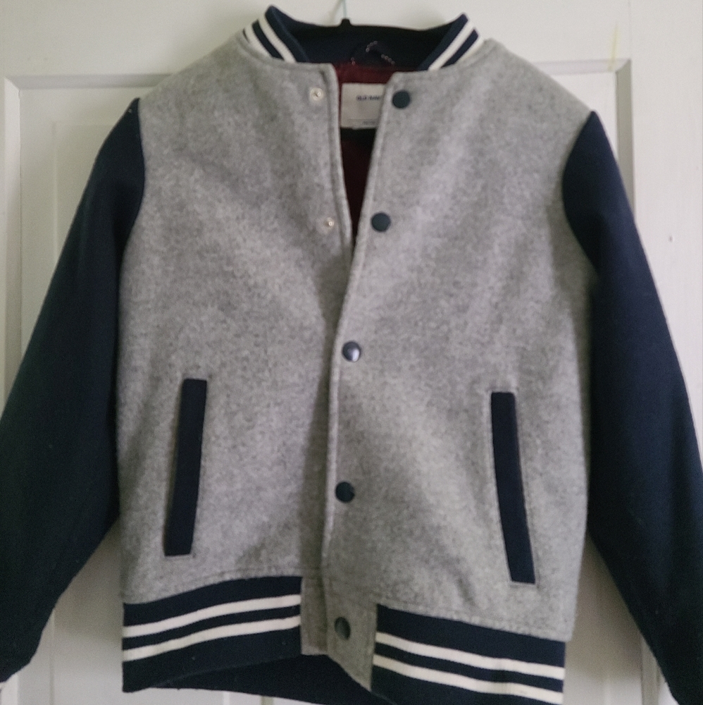 Boys soft varsity jacket in navy and grey. Size 10/12